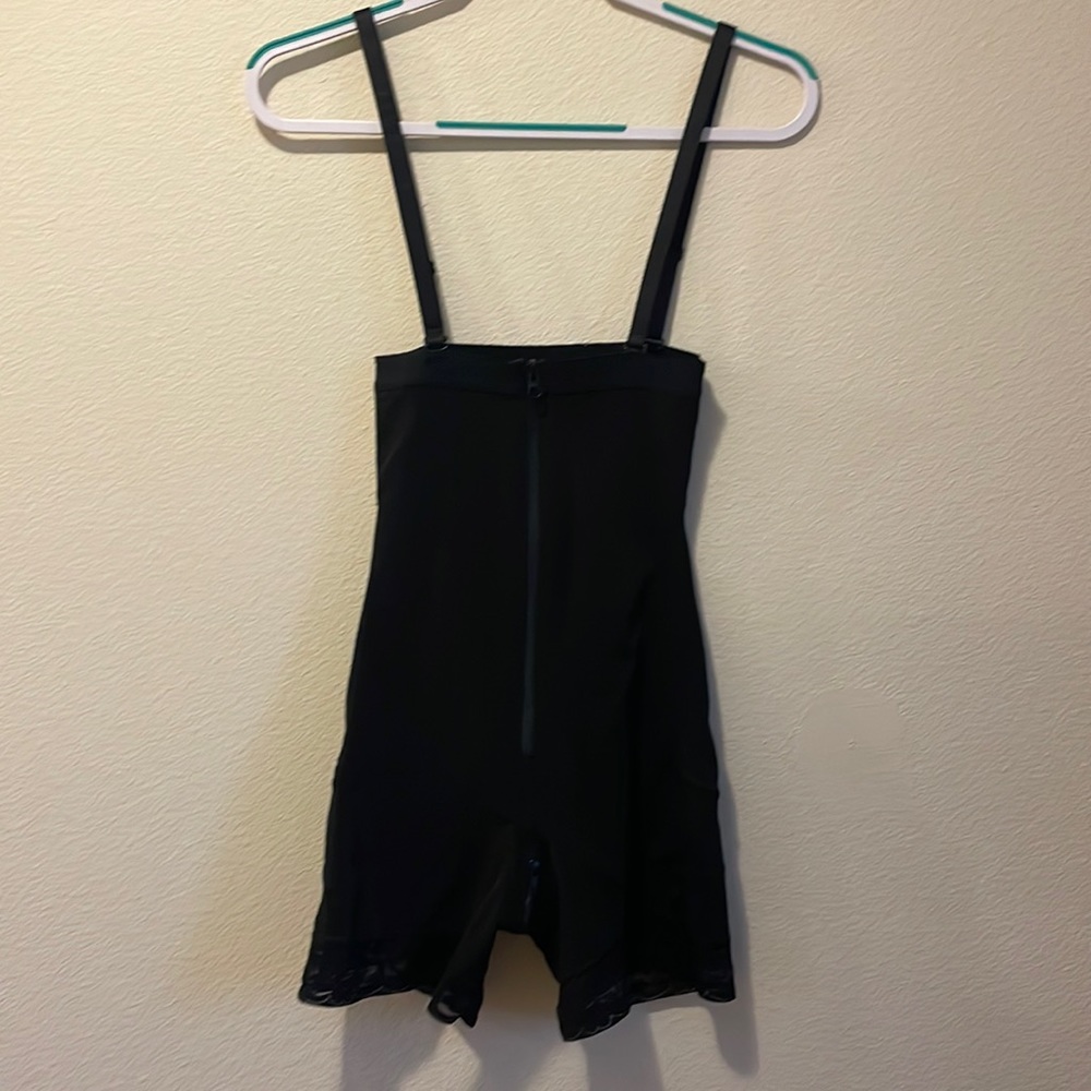 Body shaper black in color size medium.
